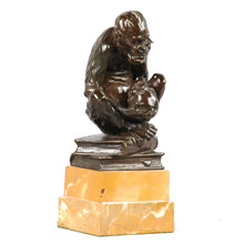 Load image into Gallery viewer, Bronze spectacled monkey with a human skull, England, c.1900