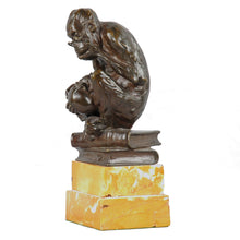 Load image into Gallery viewer, Bronze spectacled monkey considering a human skull, England, c.1900