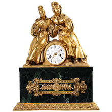 Load image into Gallery viewer, An ornate French style mantel clock featuring two gold-toned female figures seated on a dark green marble base with gold decorative accents and a white clock face.