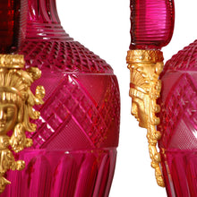 Load image into Gallery viewer, A fine pair of large ormolu-mounted cranberry colored cut glass vases in the Russian Empire style