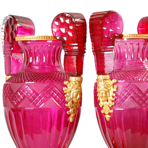 A fine pair of large ormolu-mounted cranberry colored cut glass vases in the Russian Empire style