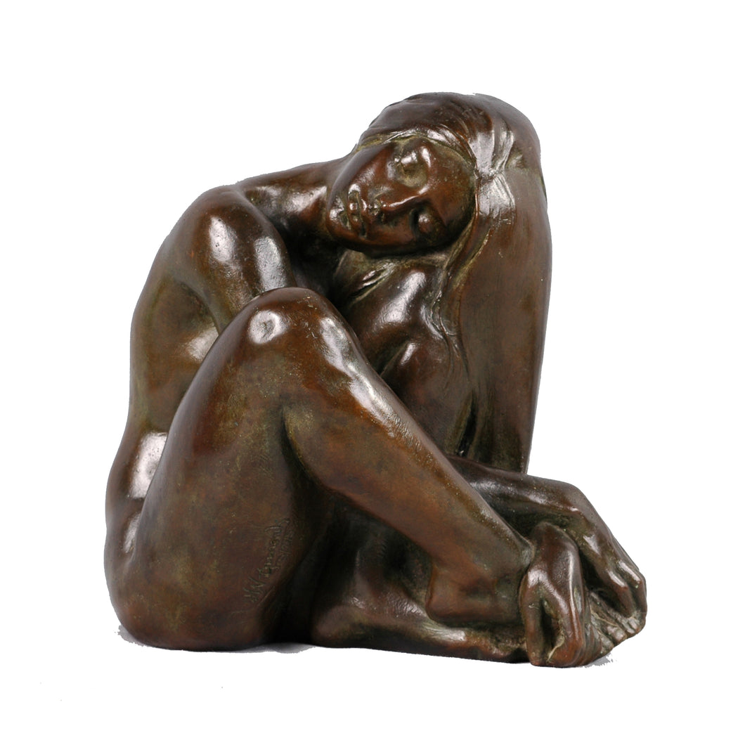 Bronze sculpture of a seated nude woman, Signed
