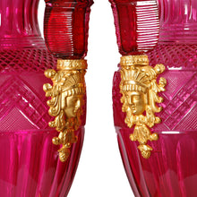 Load image into Gallery viewer, A fine pair of large ormolu-mounted cranberry colored cut glass vases in the Russian Empire style