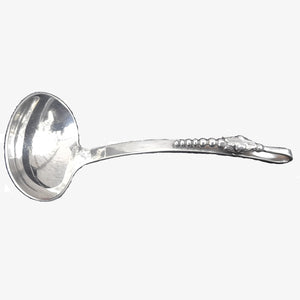 Sterling Silver ladle in the style of George Jensen’s Blossom Pattern