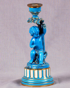 A Sèvres style turquoise glazed figural candlestick